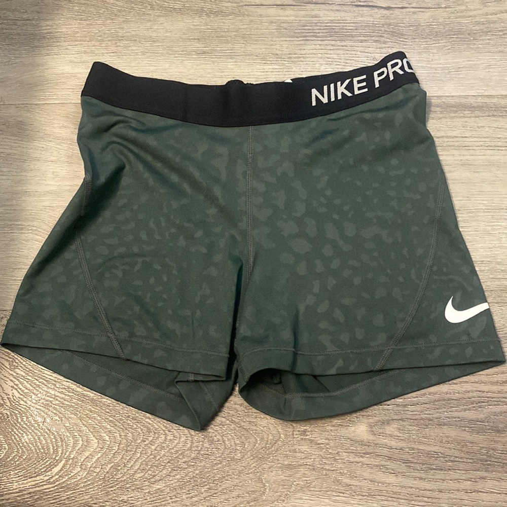 Nike pro shorts, green, and have barely been worn.